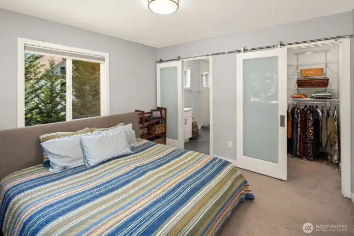 Primary bedroom suite features an attached bathroom and walk-in closet as well as a second "regular" closet.