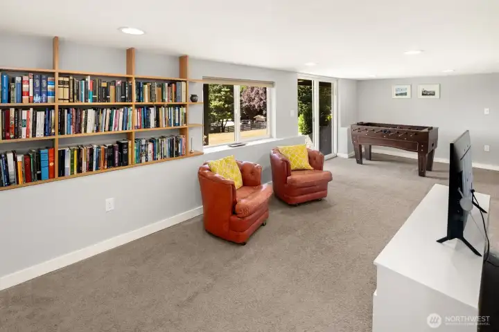 Built in book cases and a sliding glass door to the back yard.