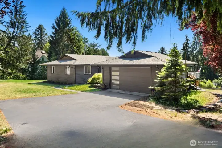 Drive right up to your two car garage, with extra driveway parking, as needed.