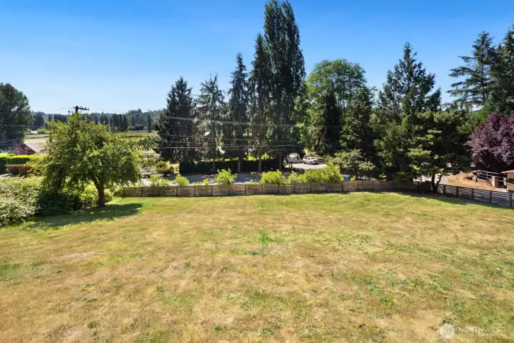 Beautiful sloping lawn offers space to run and play as well as privacy from neighbors.