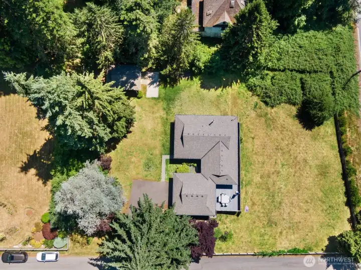 Overhead view of the house and large lot.