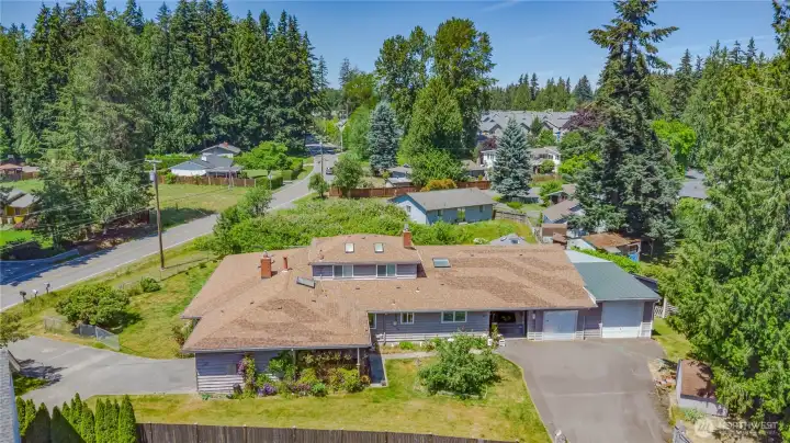 Don’t miss this spacious home in a sought-after location within a highly rated school district! Designed for flexibility, this standout property features an indoor heated pool and a large 2-bedroom MIL suite—offering the rare opportunity for two homes in one. Each side includes its own private entrance and garage, with plenty of parking, RV parking, and multiple outbuildings for additional storage. Live on one side and rent the other or enjoy the entire property as one impressive residence!