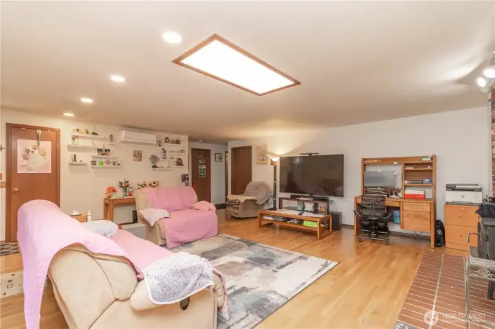 The inviting living room offers a warm and welcoming atmosphere with an open, comfortable layout designed for both everyday living and entertaining.