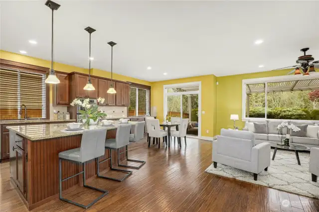 The chef's kitchen is a dream, featuring a generous island, a 5-burner gas cooktop with hood, and a convenient butler’s pantry and walk-in pantry.