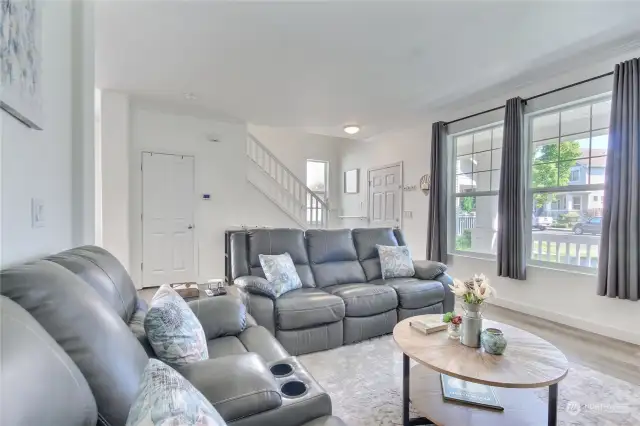 Big windows look out onto front porch