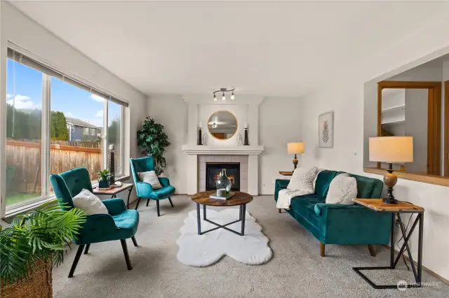 Family room off Kitchen with gas fireplace and lots of natural light