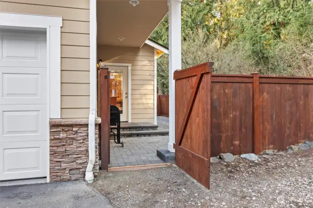 Gate from extra parking area to back patio.