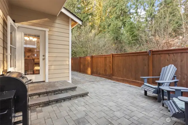 Beautiful greenbelt surrounds the outdoor entertaining space.