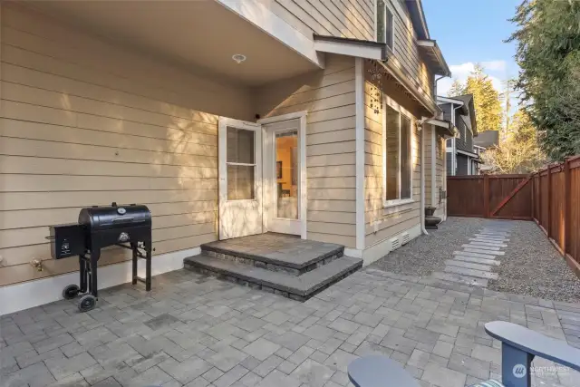 High-quality pavers and stone work throughout the fenced in back patio.