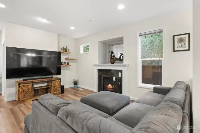 Spacious living room with gas fireplace.