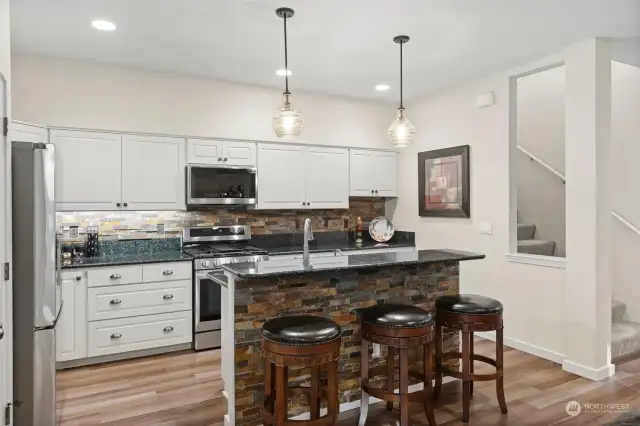 Notice the slab counter tops and updated cabinets.