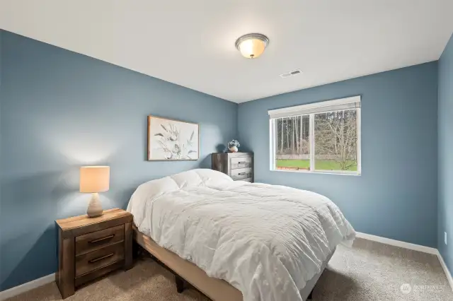 One of the bedrooms that is located on one end of the loft near the top of the stairs