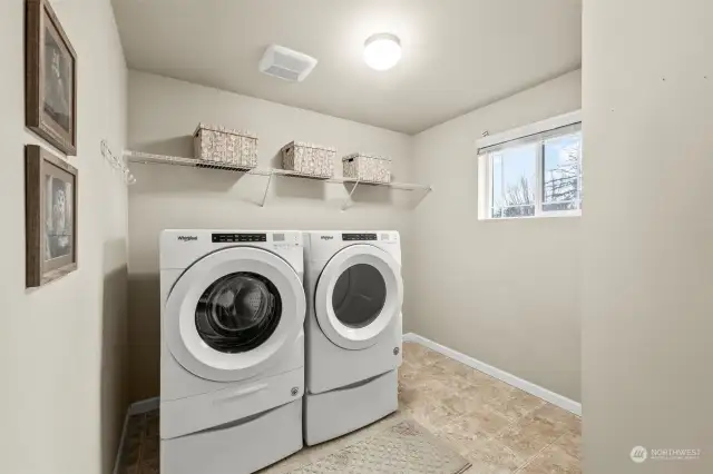 Convenient upstairs laundry room with plenty of storage