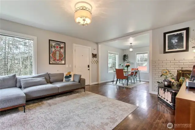 View from living room to entry and dining room. I really love the fixtures the Sellers chose throughout this home!