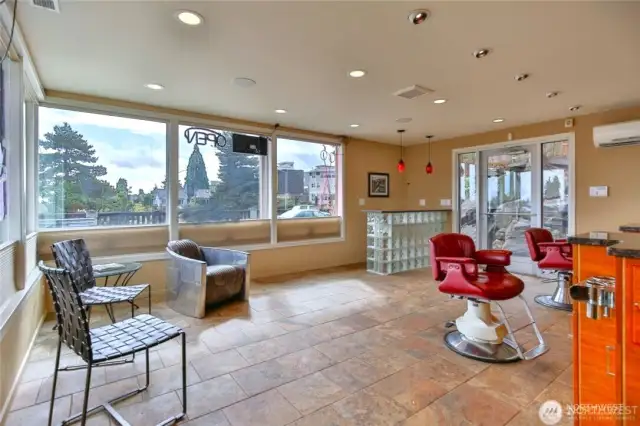 prior lower level salon usage...extensive lighting, fans & all flooring still in under carpets