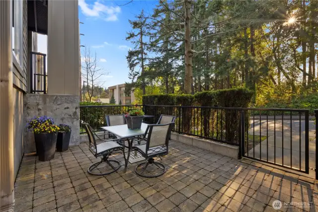 Indulge in the elegance of your expansive lower patio, a private outdoor sanctuary offering the perfect setting for relaxation or sophisticated entertaining. Surrounded by lush greenery, this serene space, provides an exclusive retreat right outside your door.