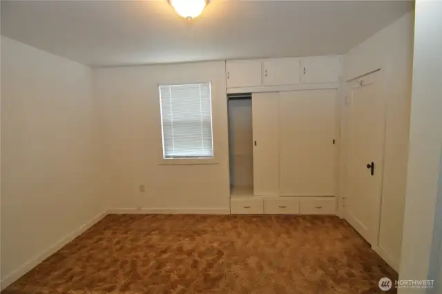 Front house bedroom has built-in closet and extra storage.