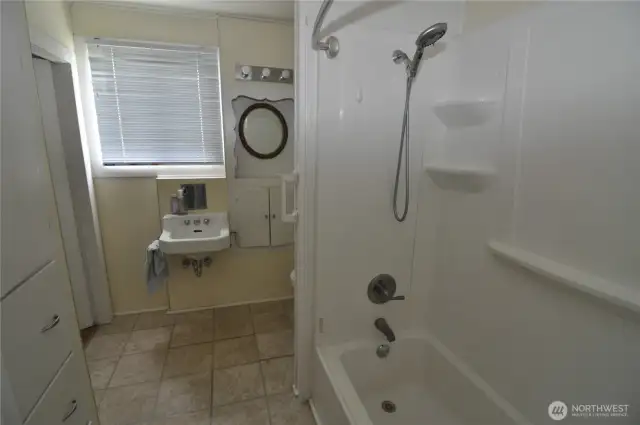 Front house bathroom is nice and large.