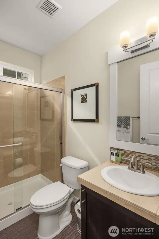 It's more than a powder room; main floor bath comes complete with a shower