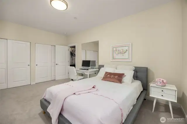 Large lower level bedroom complete with built in cabinetry
