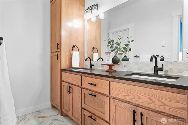 Ensuite bath has those beautiful wood cabs again, dual vanity w/undermount sinks, matte granite & linen cabinet. Walk in closet through door in mirror