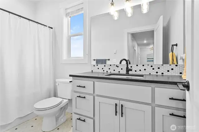 Full bathroom down same hall as bedrooms 2 & 3