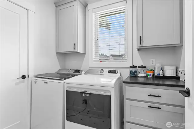 Great size utility room w/extra cabs & full closet. Love the natural light from the window