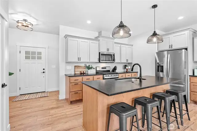 Great size kitchen w/matte black granite, stainless steel apps & full tile back splash