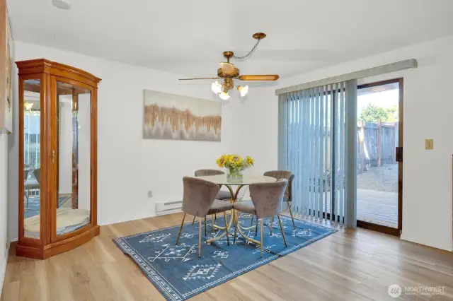 Dedicated dining space tucked conveniently between kitchen and living.
