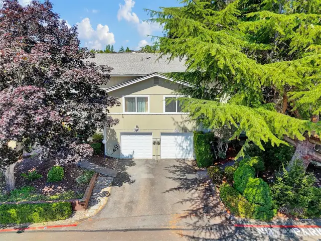 Set in a quiet, well-kept neighborhood, the front of the home offers both privacy and connection, with guest parking just steps away.