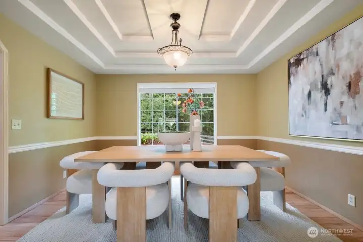 Formal dining room with Chair rail, inset ceiling treatment and duotone designer paint