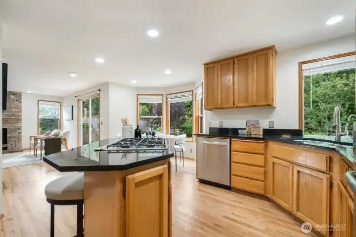 The spacious kitchen offers, stainless appliances, gas cooking, and serene view