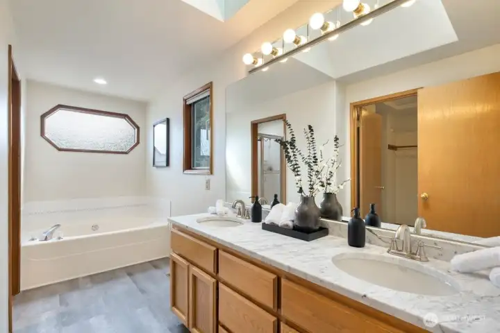 Spa-like primary suite bathroom with extra wide soaking tub