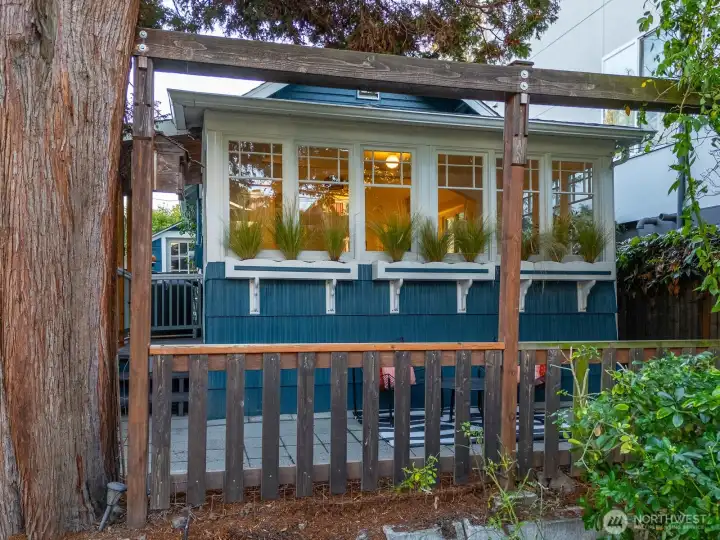 Light-filled windows pour in natural warmth, while mature trees beautifully frame your view.