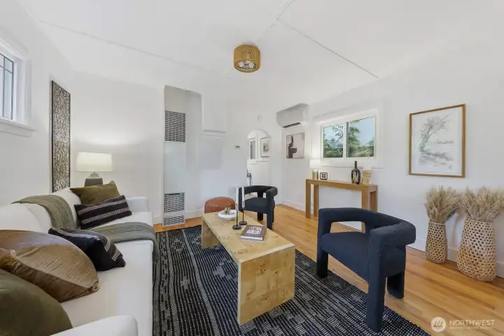 Welcome inside to arched doorways, gleaming hardwood floors, and modern comforts like mini splits — a perfect juxtaposition of classic style and contemporary ease.