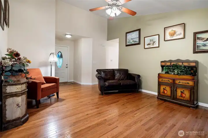 Living Room with Vaulted Ceiling and Oak Hardwood Flooring