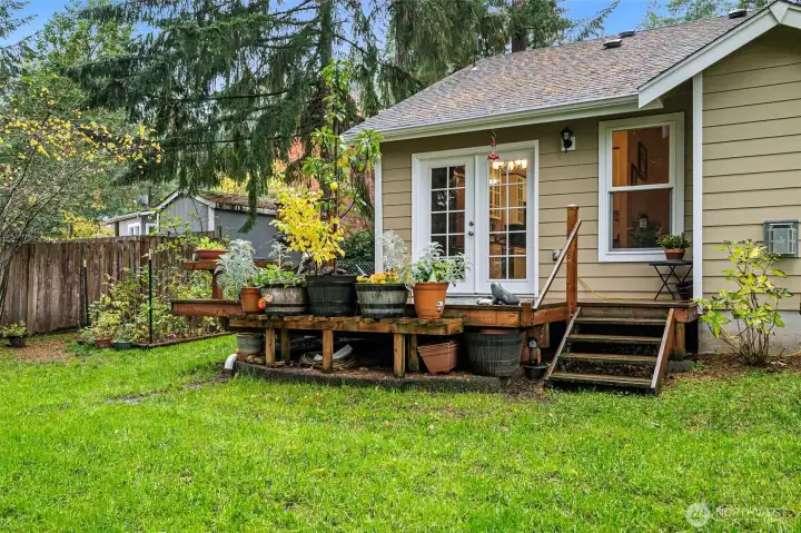 French Doors off the Dining Room to the Private Deck which has steps directly into your new backyard!
