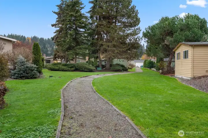 A quiet, gated community where neighbors wave, trails wind through the trees, and the clubhouse is always buzzing with something to do.