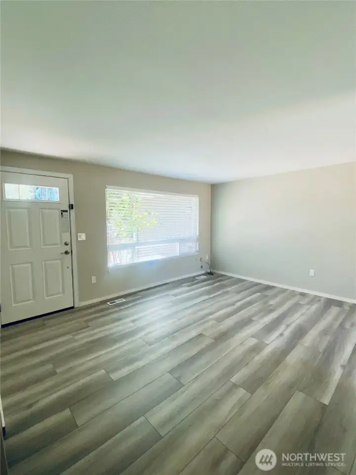 New flooring and new windows welcome you and offer lots of natural light.