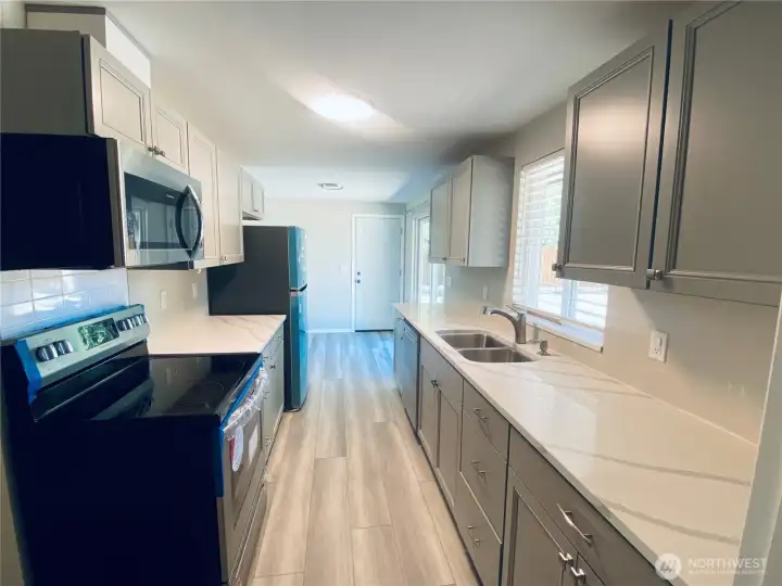 All new appliances, cabinets, and countertops in the kitchen.