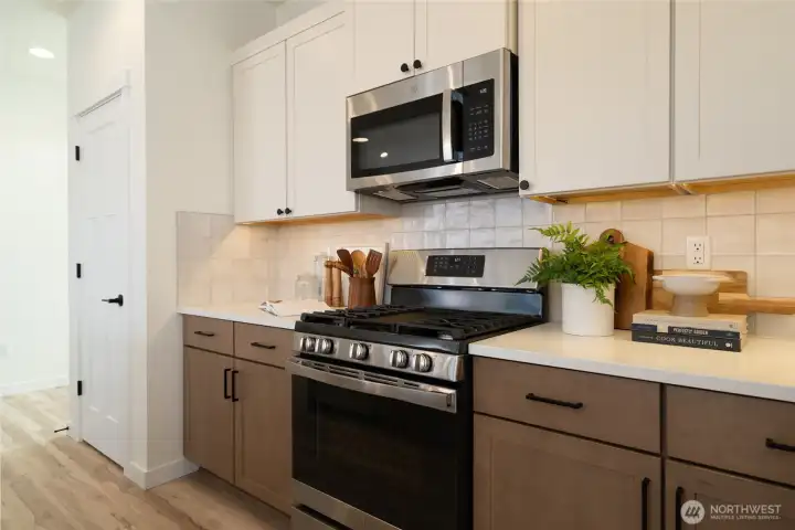 Kitchen - Pics are of a different 1785 plan. Features and colors may differ.