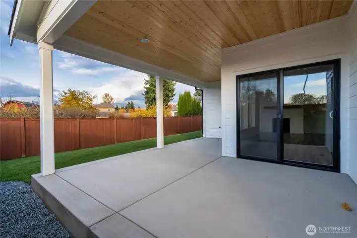 Covered patio and fenced backyard. Pics are of a different 1785 plan. Features and colors may differ.