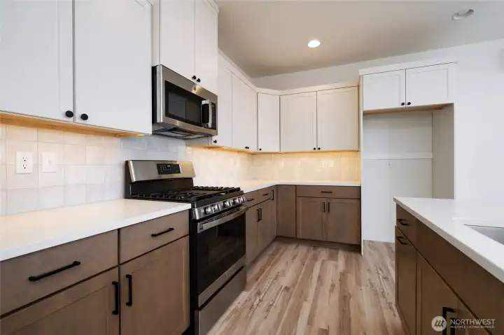 Kitchen - Pics are of a different 1785 plan. Features and colors may differ.