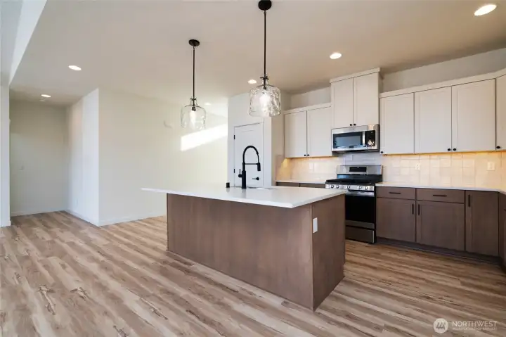 Kitchen - Pics are of a different 1785 plan. Features and colors may differ.