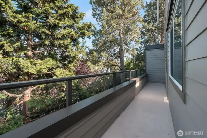 Spacious deck has pleasant outlook on to the trees.