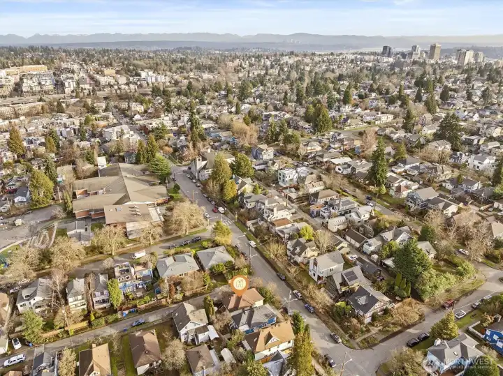 aerial photo looking east. Green Lake is just a couple of blocks away! Green Lake celebrated for its walkability. Whether you're strolling to the lake, visiting local shops, or enjoying the plethora of dining options, everything you need is within easy reach. Plus with Amazon, UW, downtown and 520 only minutes away, the best of Seattle is at your doorstep.