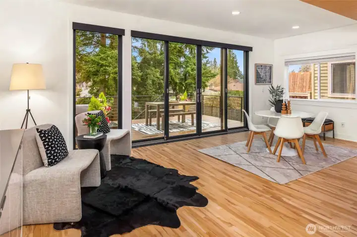 Wall of windows allow the west light in and inside/outside living