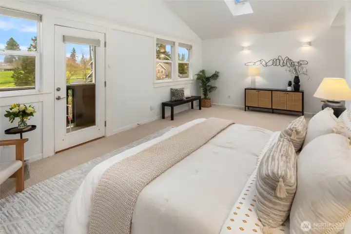 Relaxing retreat! Primary bedroom with deck overlooking the golf course.