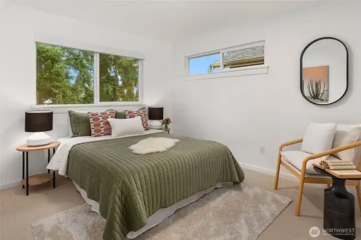 One of 3 additional bedroom on the upper floor. This overlooks the private yard.