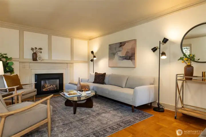 Gas fireplace and original picture rail molding for hanging art.